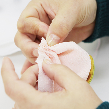 Each stitch is carefully performed by hand.